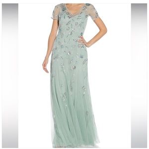 Adrianna Papell gown. Embellished beading on soft misty green -blue tulle .